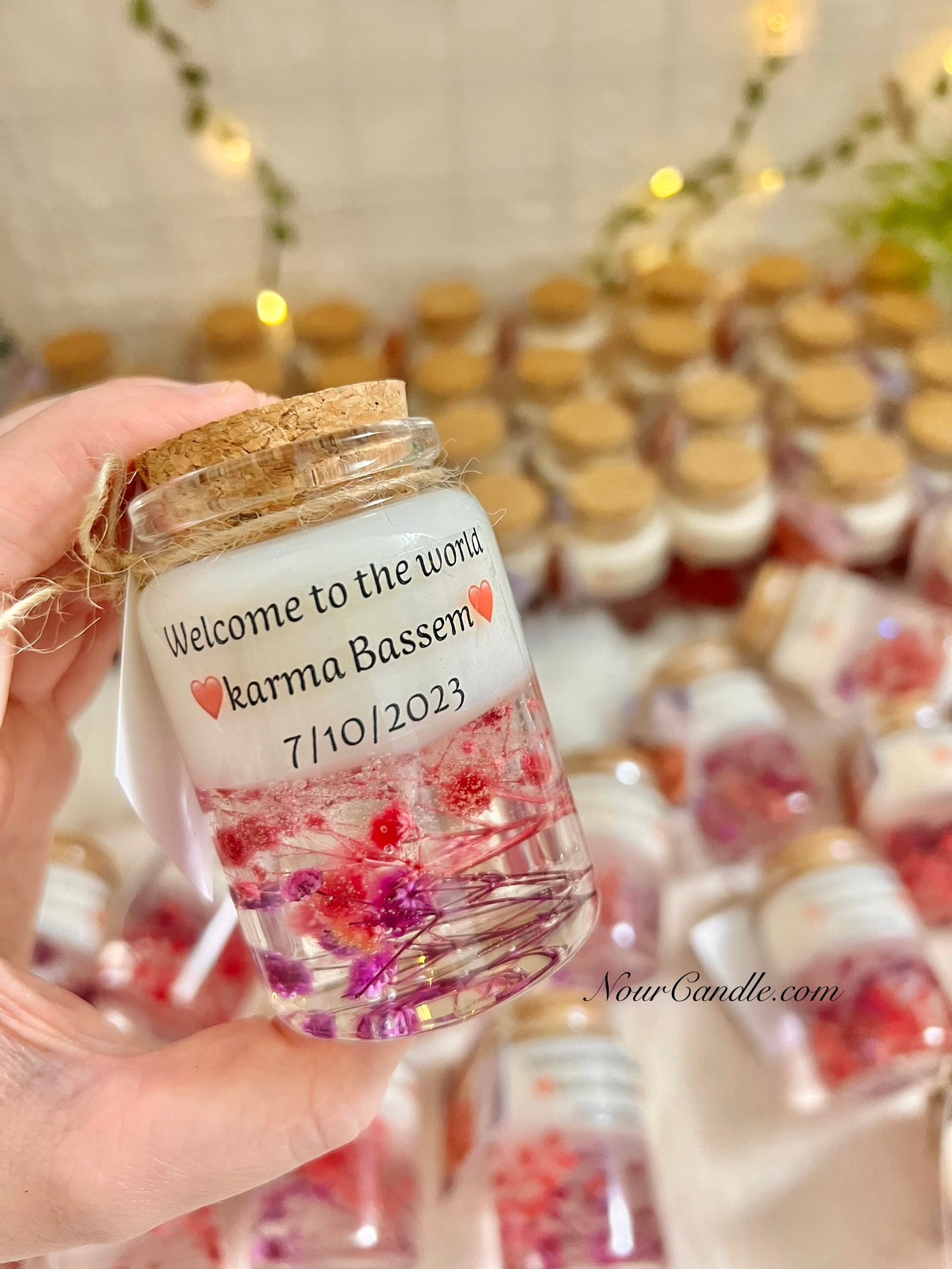 Glass candles with dried roses